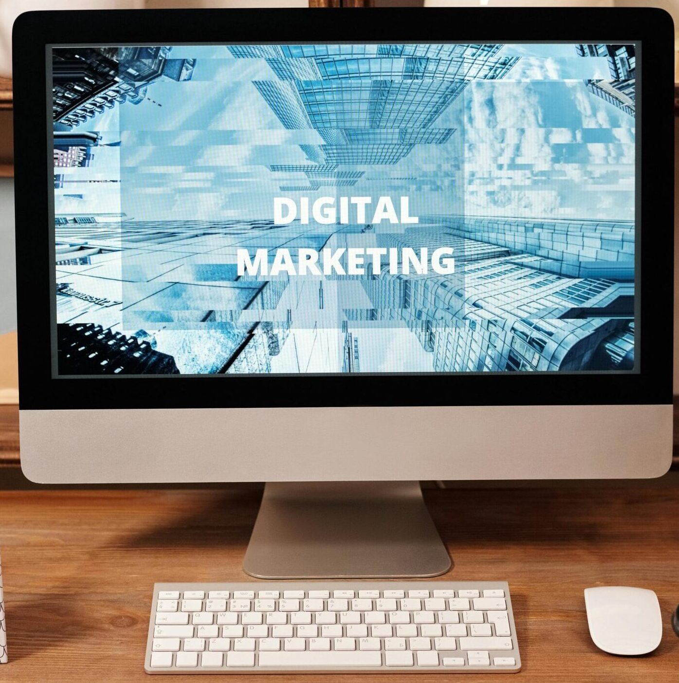 Contemporary office setup featuring digital marketing strategy on a computer screen, ideal for business technology themes.