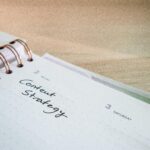 Close-up of a notebook page with 'Content Strategy' written on it, ideal for business planning visuals.
